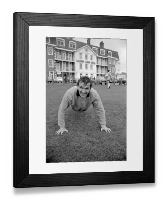 Framed Print : Terry Paine of Hereford United in the pouring rain at the Balmer Lawn Hotel in the New