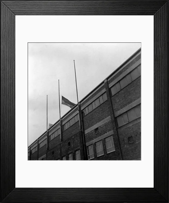 Framed Print : The club flag of Manchester United flying at half mast at Old Trafford in memory of Framed Print : The club flag of Manchester United flying at half mast at Old Trafford in memory of