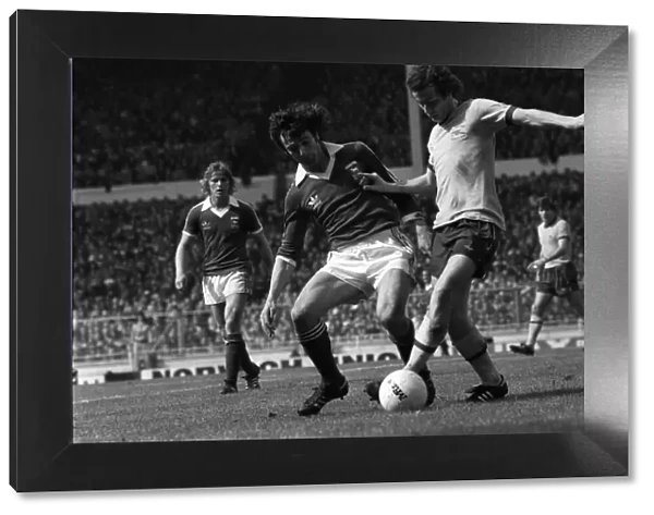 Liam Brady of Arsenal is tackled by Ipswich defender 1978 in the FA Cup Final at