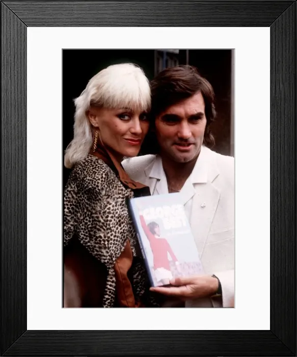 Framed Print : George Best and Angela Best with his book March 1982