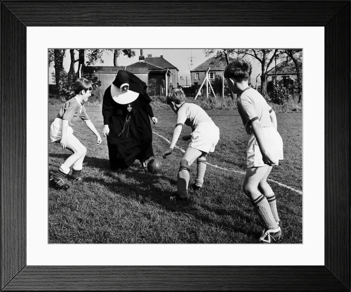 Framed Print : Sister John Gabriel deputy head mistress coaching the schools football team. 1965 Framed Print : Sister John Gabriel deputy head mistress coaching the schools football team. 1965