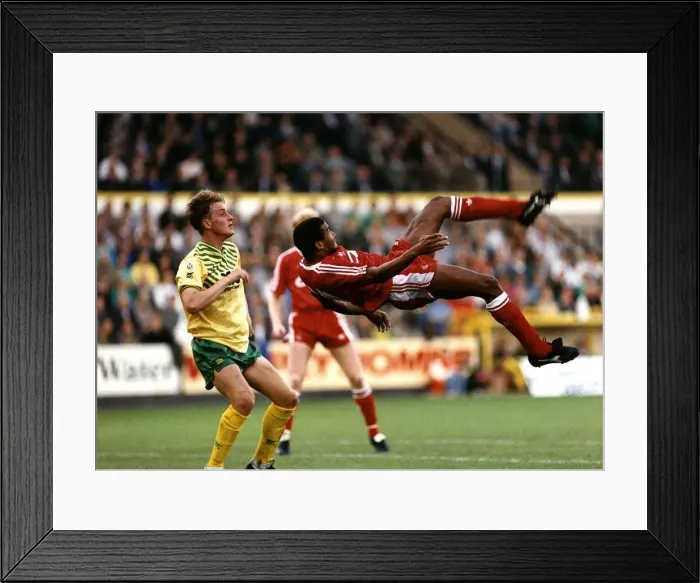 Framed Print : John Barnes of Liverpool FC tries a spectacular overhead kick watched by Norwich City Framed Print : John Barnes of Liverpool FC tries a spectacular overhead kick watched by Norwich City