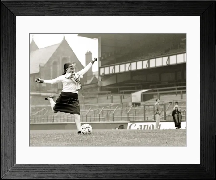 Framed Print : Soccer Sister - Nun kicking football shooting at goal Goodison Park Everton Framed Print : Soccer Sister - Nun kicking football shooting at goal Goodison Park Everton