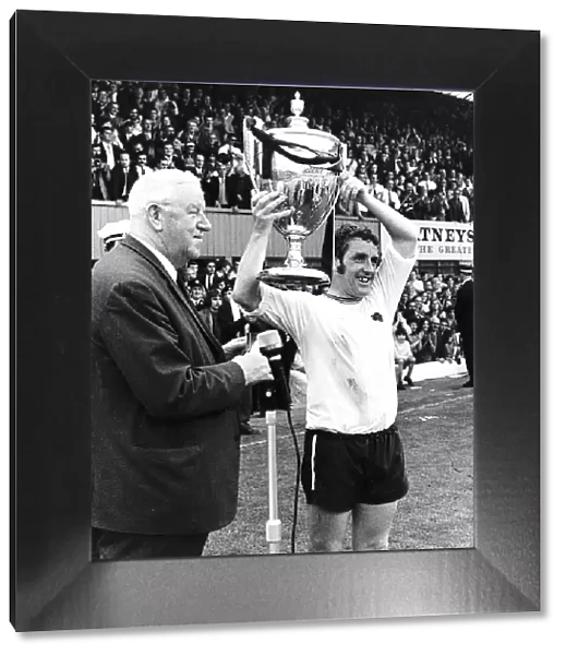 Dave Mackay of Derby holding up the Watney Cup after Derby beat Manchester United