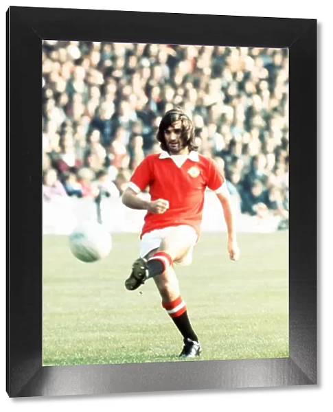 George Best Manchester United Footballer kicking ball 1973