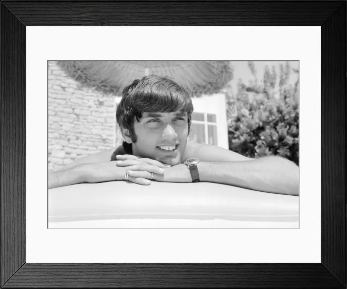 Framed Print : George Best relaxing on an inflatable bed whilst on holiday April 1967 Framed Print : George Best relaxing on an inflatable bed whilst on holiday April 1967