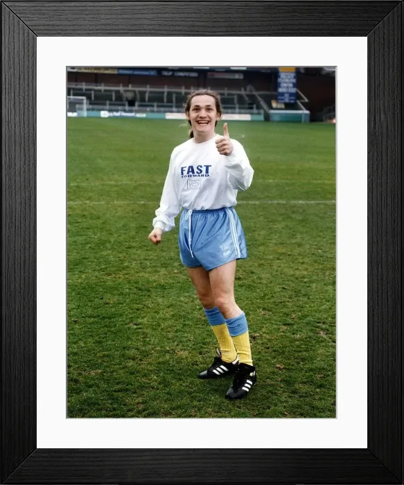 Framed Print : Sid Owen Actor stars as Ricky in Eastenders in Football ground wearing soccer kit costume