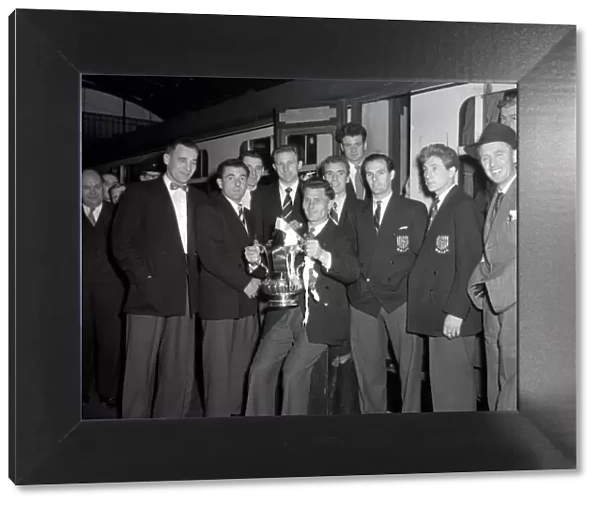 West Bromwich Albion Players with the FA Cup trophy prior to boarding the train as they