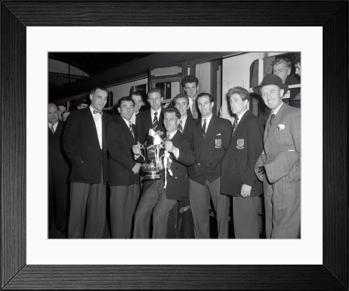 Framed Print : West Bromwich Albion Players with the FA Cup trophy prior to boarding the train as they