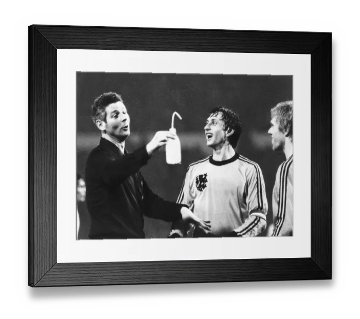 Framed Print : Dutch footballer Johan Cruyff shares a joke with the referee during the England v Holland