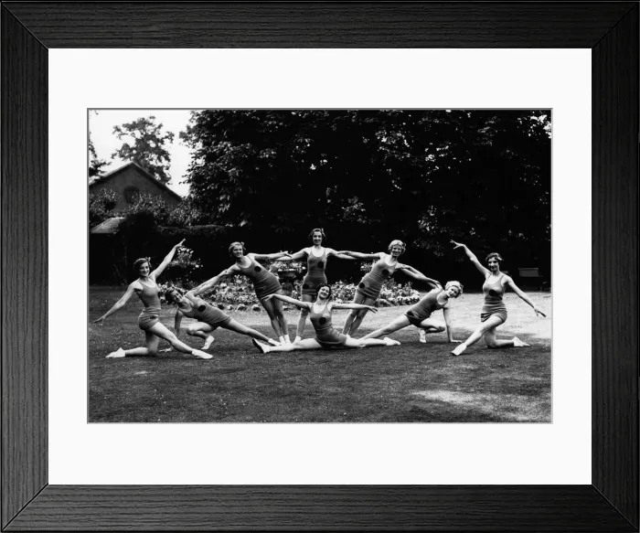 Framed Print : The Mirror Eight girls practicing their moves for promoting the Daily Mirror Framed Print : The Mirror Eight girls practicing their moves for promoting the Daily Mirror