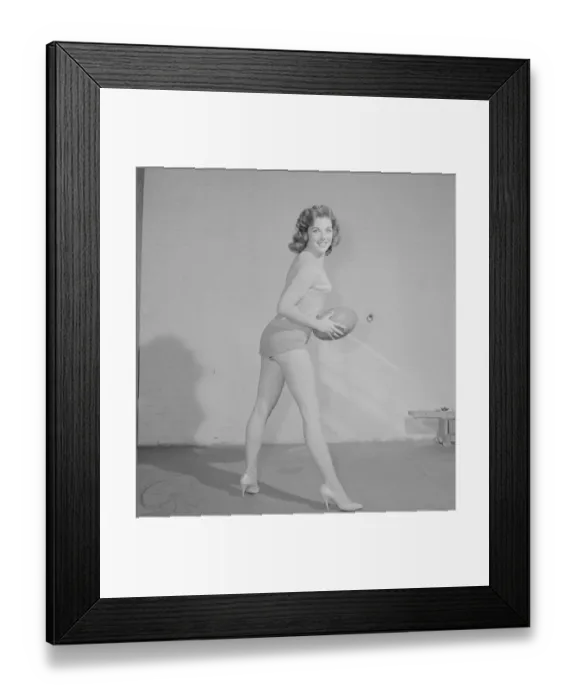 Framed Print : Reveille Fashion Feature The Vernon girls pose with rugby balls in the reveille