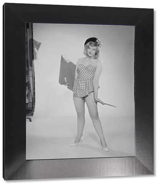 Reveille art Feature. Model Peggy Cage seen here wearing a check short summer dress