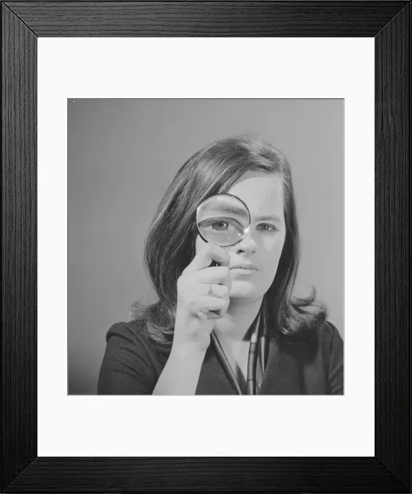 Framed Print : Model Jennie Cropp with magnifying glass