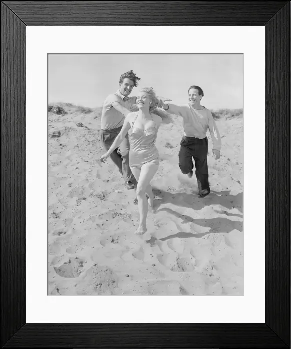 Framed Print : A group of friends seen here playing on the beach at Llandudno, North Wales Framed Print : A group of friends seen here playing on the beach at Llandudno, North Wales