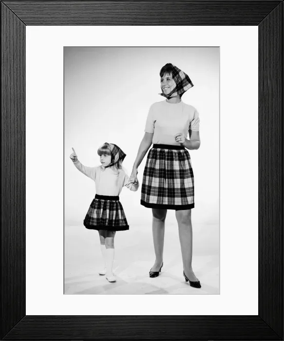 Framed Print : Plaid skirt fashion shoo. Mother and daughter in matching check skirts Framed Print : Plaid skirt fashion shoo. Mother and daughter in matching check skirts