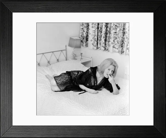 Framed Print : Woman modelling Lingerie on a bed Framed Print : Woman modelling Lingerie on a bed