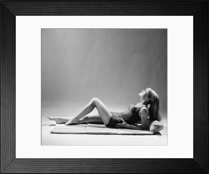 Framed Print : Beach furniture feature, model in swimsuit. Circa 1964 Framed Print : Beach furniture feature, model in swimsuit. Circa 1964