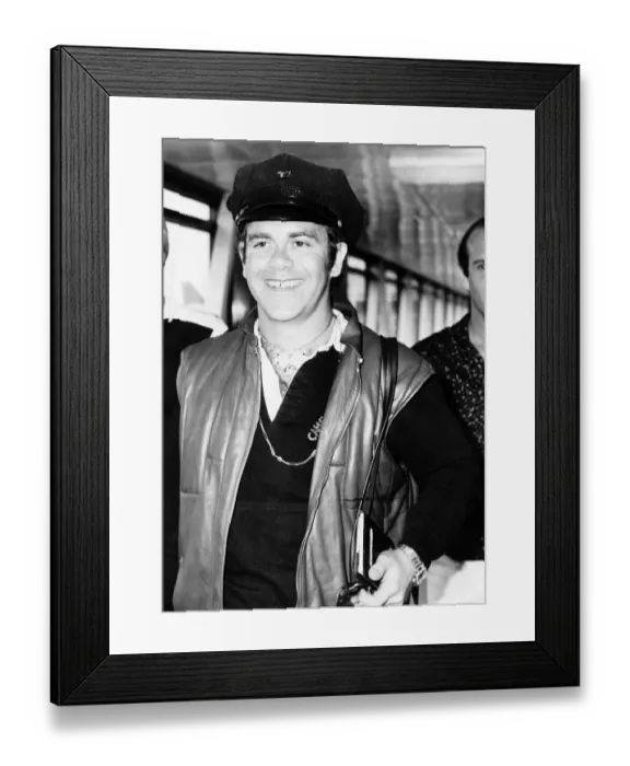 Framed Print : Singer, Elton John, arriving at London Airport from Nice. 29th July 1980 Framed Print : Singer, Elton John, arriving at London Airport from Nice. 29th July 1980