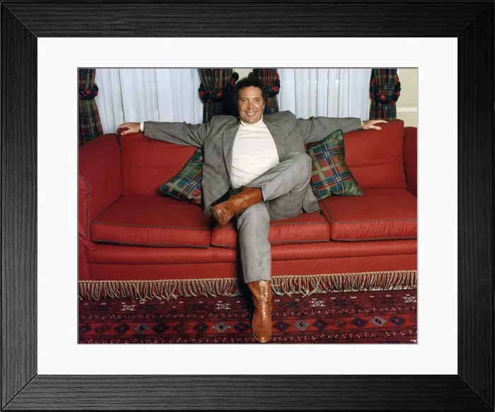 Framed Print : Tom Jones entertainer singer sits on sofa setee Framed Print : Tom Jones entertainer singer sits on sofa setee