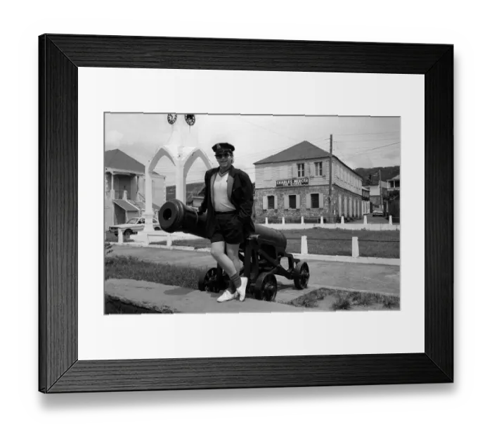 Framed Print : Elton John Singer Songwriter standing beside a cannon on the West Indies Island of