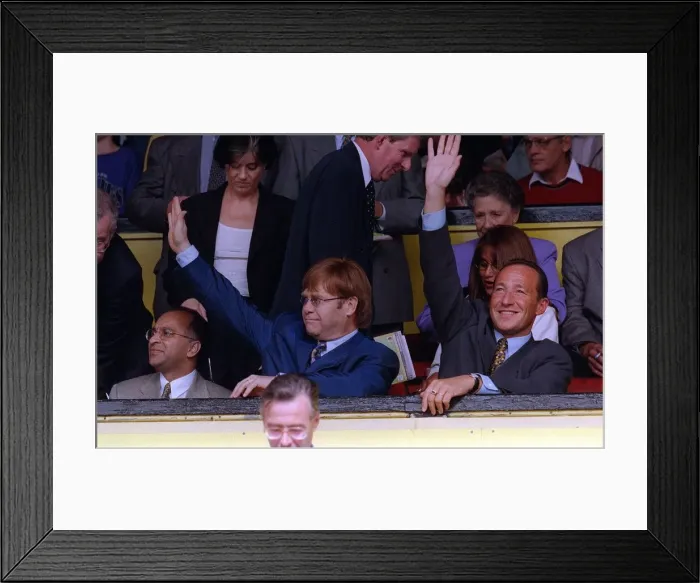 Framed Print : Elton John centre singer and Watford FC Chairman waves to the crowd after receiving a Framed Print : Elton John centre singer and Watford FC Chairman waves to the crowd after receiving a