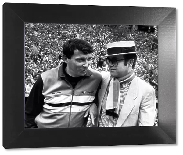 Graham Taylor Watford manager shares an historic moment with his chairman Elton John