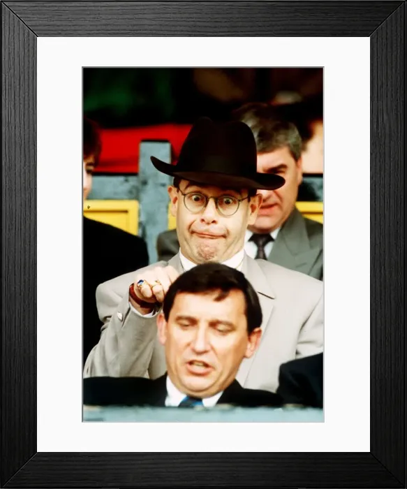 Framed Print : Elton John Pop Singer standing behind Graham Taylor Framed Print : Elton John Pop Singer standing behind Graham Taylor