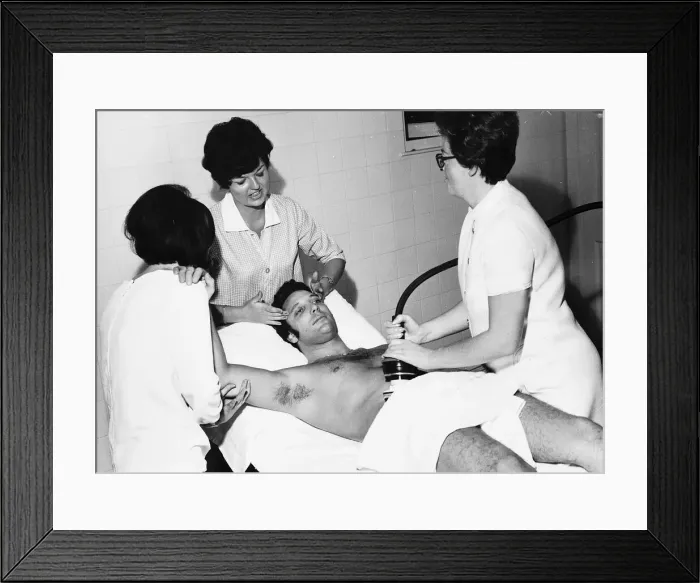 Framed Print : Tom Jones Singer pays a vist to a health farm laying on bed getting a massage Framed Print : Tom Jones Singer pays a vist to a health farm laying on bed getting a massage