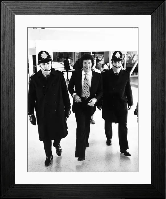 Framed Print : Tom Jones Pop Singer being escorted by Police at Heathrow Airport Framed Print : Tom Jones Pop Singer being escorted by Police at Heathrow Airport
