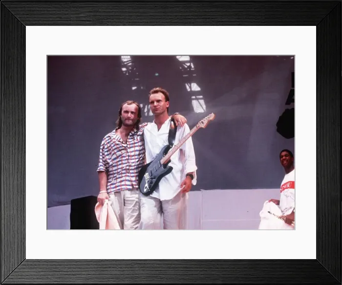 Framed Print : Sting singer and Phil Collins at a live aid concert at Wembley