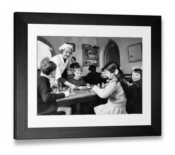 Framed Print : Pupils enjoying their school dinner