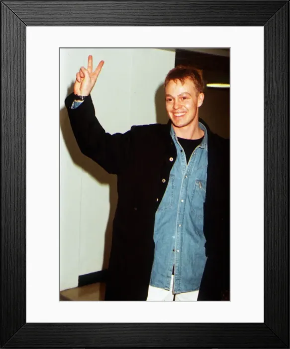 Framed Print : Jason Donovan giving two finger peace sign