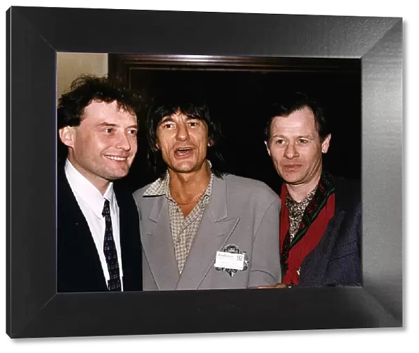 Alex Higgins poses with fellow snooker player Jimmy White and Ronnie Wood