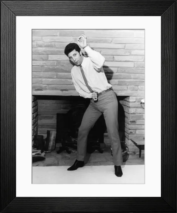 Framed Print : Tom Jones Singer Singing infront of fireplace Framed Print : Tom Jones Singer Singing infront of fireplace