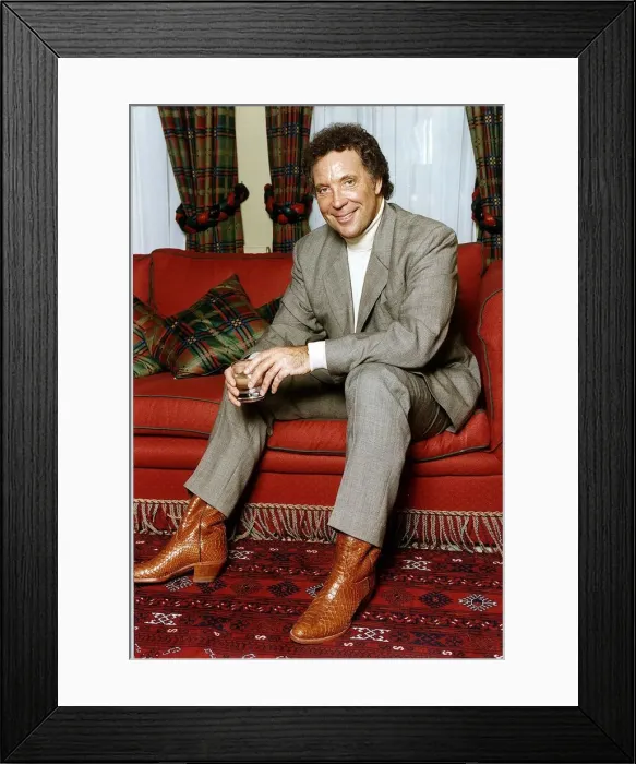 Framed Print : Tom Jones British Singer Sitting on a red couch Holding a glass Framed Print : Tom Jones British Singer Sitting on a red couch Holding a glass
