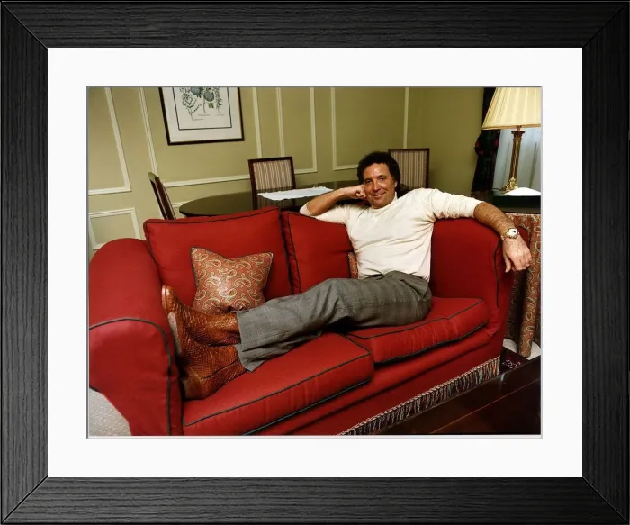 Framed Print : Tom Jones singer lying on a red couch Framed Print : Tom Jones singer lying on a red couch