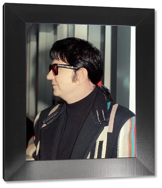 Roy Orbison at Heathrow Airport November 1988 in multi coloured coat