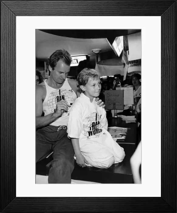 Framed Print : Sting former lead singer with pop group The Police signing youngsters shoulder before Framed Print : Sting former lead singer with pop group The Police signing youngsters shoulder before
