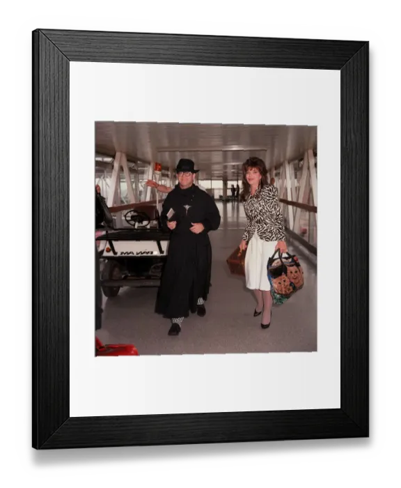 Framed Print : Elton John arriving at London Airport July 1987