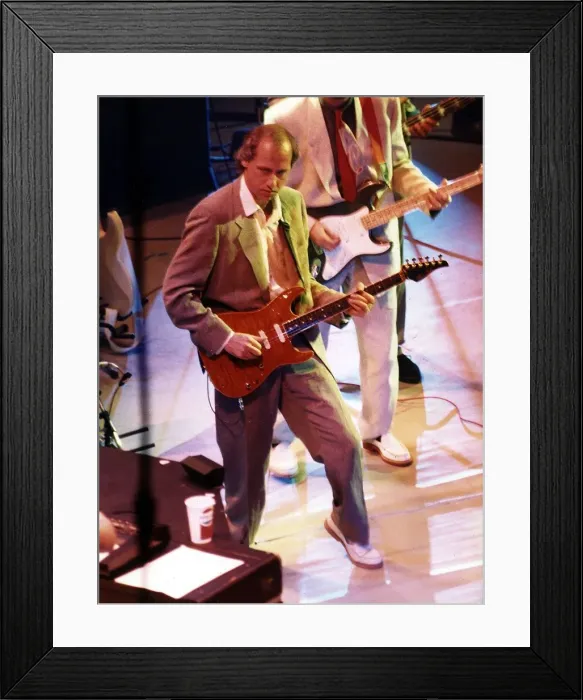 Framed Print : Mark Knopfler guitarist singer and musician at the Albert Hall performing on stage