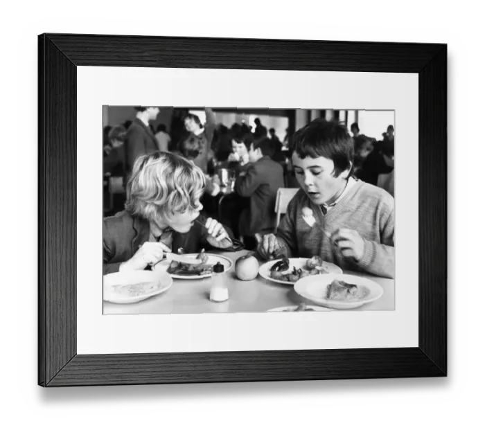 Framed Print : These boys are tucking into their school dinner Framed Print : These boys are tucking into their school dinner