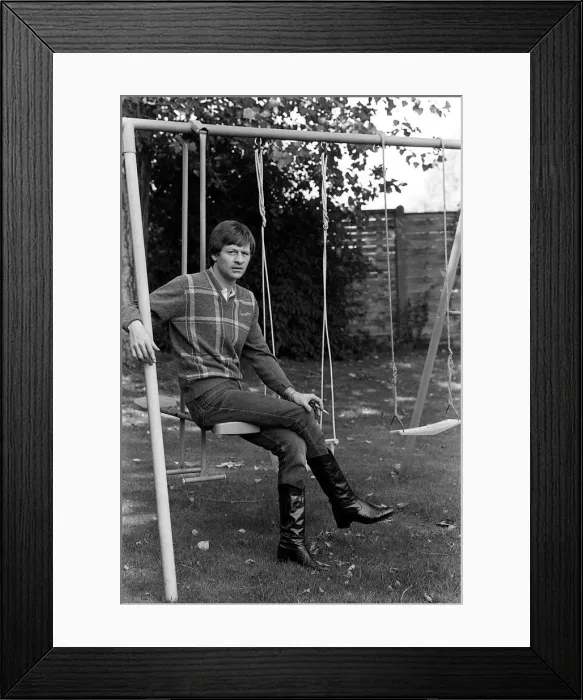 Framed Print : Alex Higgins former World Snooker Champion 1983 has a swing in his garden Framed Print : Alex Higgins former World Snooker Champion 1983 has a swing in his garden