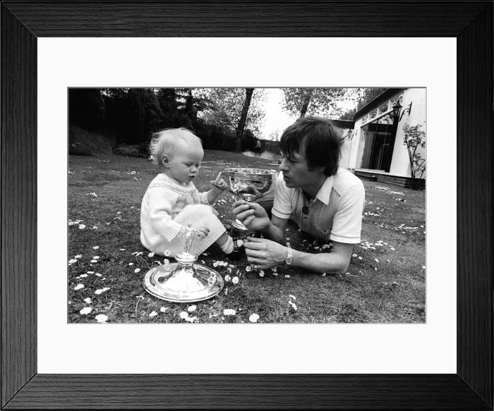 Framed Print : Alex Higgins World Snooker Champion 1982 playing in the garden with his daughter Framed Print : Alex Higgins World Snooker Champion 1982 playing in the garden with his daughter