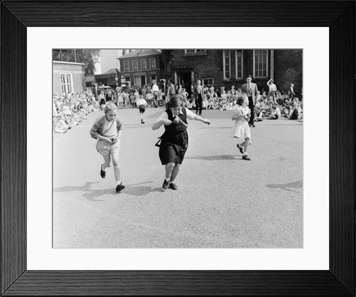 Framed Print : Girls of Oliver Goldsmith Junior School in Peckham London take part in the egg Framed Print : Girls of Oliver Goldsmith Junior School in Peckham London take part in the egg