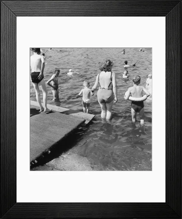 Framed Print : Londons Hyde Park Lido. A mother helps her child into the Serpentine Framed Print : Londons Hyde Park Lido. A mother helps her child into the Serpentine