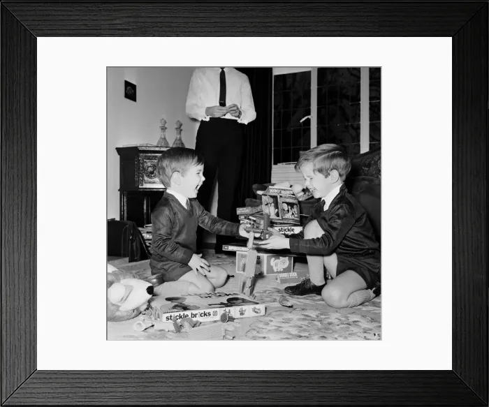 Framed Print : Brothers Martin and Timothy Fieldhouse playing stickle bricks in the living room of their Framed Print : Brothers Martin and Timothy Fieldhouse playing stickle bricks in the living room of their