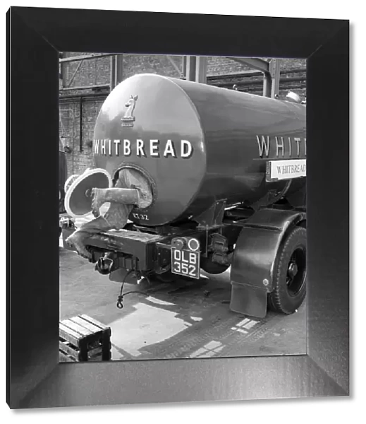 A tanker driver seen here cleaning out the inside of his vehicle at the Whitbread brewery