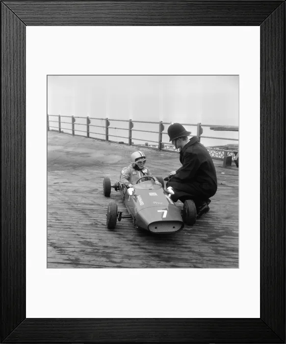 Framed Print : Eight year old Thomas Barnard in his racing car, speaking to a policeman on the West Pier Framed Print : Eight year old Thomas Barnard in his racing car, speaking to a policeman on the West Pier