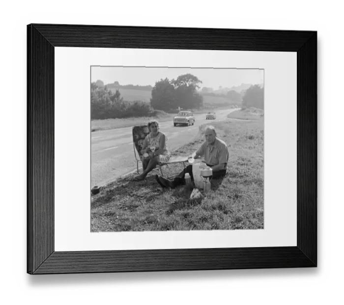 Framed Print : Tom and Lily Mattingly of Brentwood, Essex enjoy a picnic on the side of the main Newton Framed Print : Tom and Lily Mattingly of Brentwood, Essex enjoy a picnic on the side of the main Newton